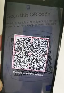 Scanning QR codes displayed on an old phone using a new phone camera.