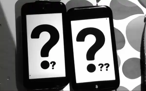 Two mobile phones with question marks displayed on the screen.